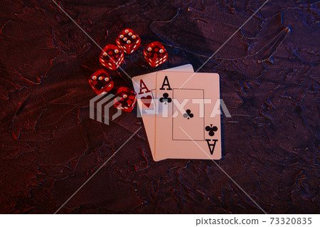Online gambling theme. Aces and five red dices on a grey background 73320835