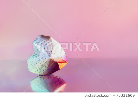 Sparkling geometric heart with a reflection on a neon pink background. Dotted gradient white and pink polygonal heart lying on glancing surface. Modern Creative Valentine's day card. Minimalist style. Sparkling geometric heart with a reflection on a neon pink background. Dotted gradient white and pink polygonal heart lying on glancing surface. Modern Creative Valentine's day card. Minimalist style. 73321609