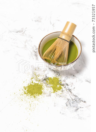 Matcha tea cup stone background Traditional japanese drink Matcha tea cup stone background Traditional japanese drink 73321957