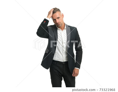 Handsome unshaven man in formal fashion wear touch head hair isolated on white, haircare 73321968