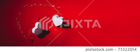 White wooden hearts with strong shadows 73322054