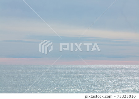 sea in winter with clouds 73323010
