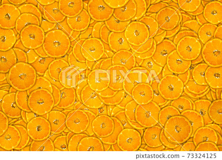 Mandarine Citrus reticulata background covered with slices. Mandarine Citrus reticulata background covered with slices. 73324125