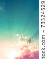sky and clouds nature background, blue green sky with red pink and orange sun light on clouds 73324529