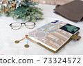 Image of women's belongings, notebook, bag, glasses and dried flowers 73324572