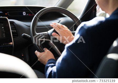 Image of a man who smoothes his horn and drives Image of a man who smoothes his horn and drives 73325139