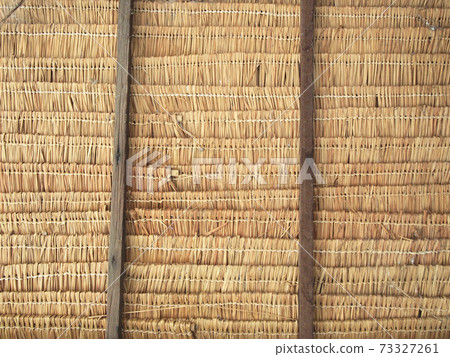 Close up straw background. Texture of thatch roof 73327261