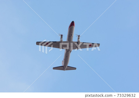 Air Self-Defense Force YS-11FC flight checker flying overhead 73329632