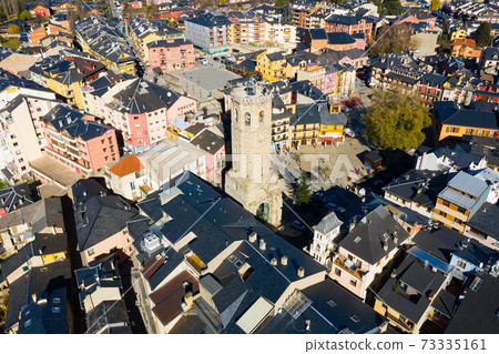 Aerial view of Spanish town of Puigcerda with medieval church belfry Aerial view of Spanish town of Puigcerda with medieval church belfry 73335161