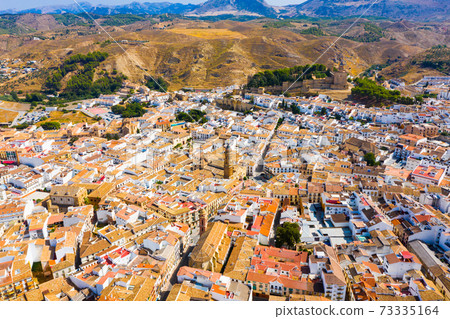 Aerial view of Antequera overlooking alcazaba and San Sebastian Church, Spain 73335164