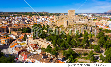 Aerial view of Spanish town of Almansa with Castle on hilltop 73335228