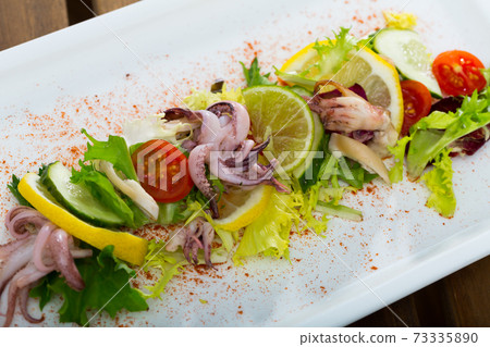 Salad with boiled squid 73335890