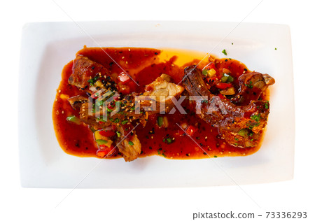 Asian style sticky ribs in sweet and spicy sauce Asian style sticky ribs in sweet and spicy sauce 73336293