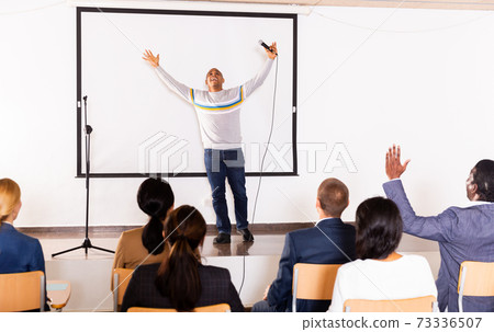 Emotional hispanic business coach giving motivational training Emotional hispanic business coach giving motivational training 73336507