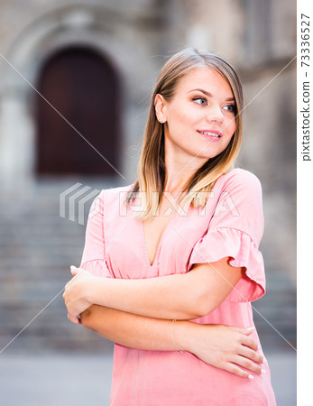 Girl walking in Barcelona streets 73336527