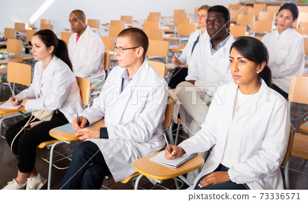 People listening to lecture at medical conference People listening to lecture at medical conference 73336571