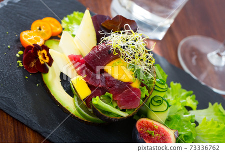 Tuna salad with avocado and mango Tuna salad with avocado and mango 73336762