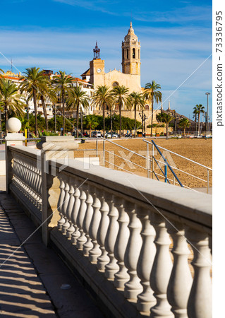 view of church on coast of Sitges in Spain 73336795