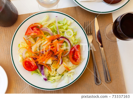 Close up of Spanish vegeterian salad on white plate 73337163