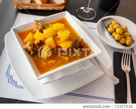 Potatoes with ribs and chorizo. Spanish cuisine 73337516