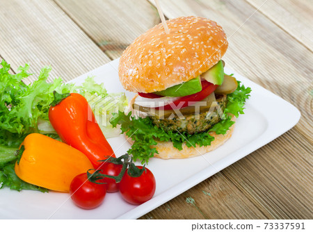 Vegan burger with greens 73337591