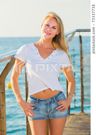 Female is posing on pirce in her free time Female is posing on pirce in her free time 73337738
