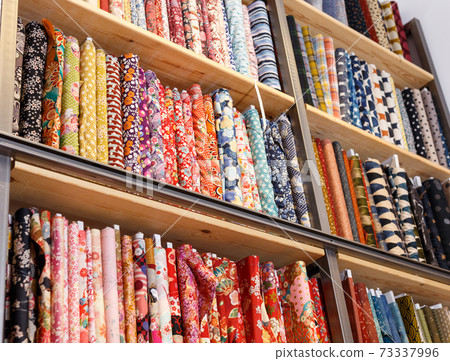 Cloth rolls on store shelves 73337996