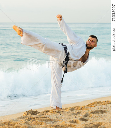 Young male is training kick Young male is training kick 73338007