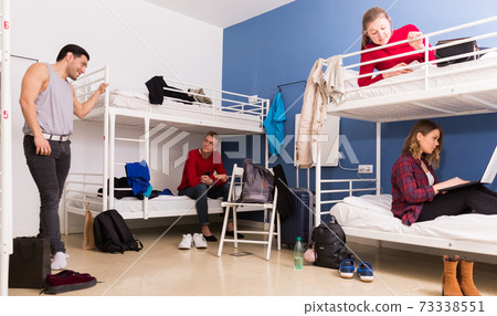 Young people interacting in hostel Young people interacting in hostel 73338551