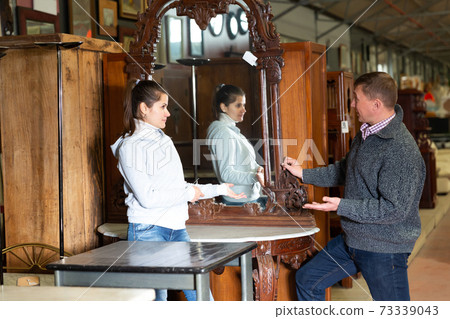 Couple visiting furniture store Couple visiting furniture store 73339043
