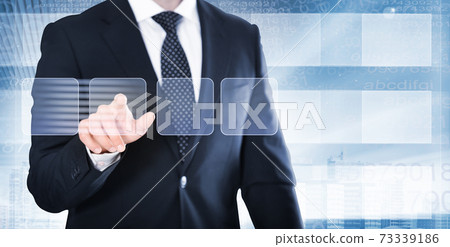 Man in suit touching screen 73339186
