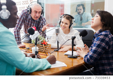 Radio hosts interviewing guest Radio hosts interviewing guest 73339453