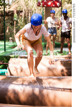 People passing obstacle at adventure park People passing obstacle at adventure park 73339765