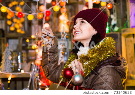 Teenage girl shopping at festive fair before Xmas Teenage girl shopping at festive fair before Xmas 73340638