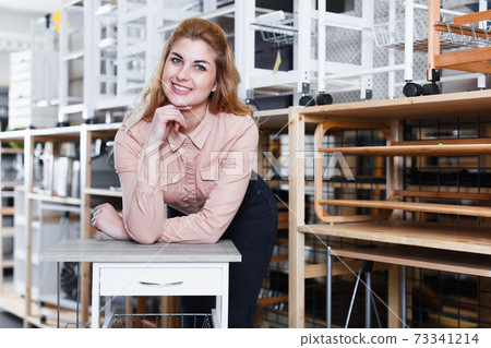Female customer in furnishing shop 73341214