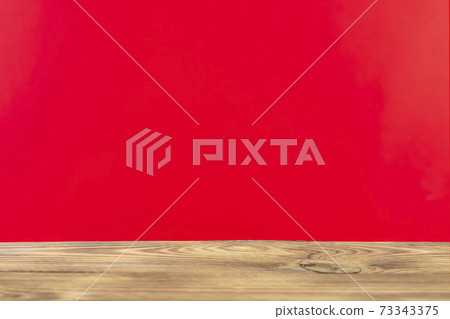 Wooden board empty table in front of a blurred background. Perspective brown wood with a blurry multi-colored background - can be used to showcase or assemble your products. Mock up 73343375