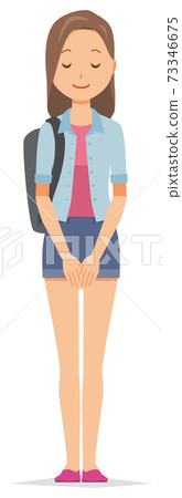 A young woman with a backpack is bowing A young woman with a backpack is bowing 73346675