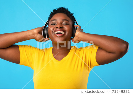 Happy Oversized Black Lady In Headphones Listening Music In Studio 73349221