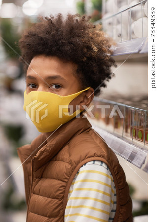 African-American Boy Wearing Mask in Store 73349339