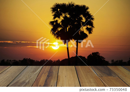 Empty wooden table on sunset nature background. Mock up for your product display or montage 73350048