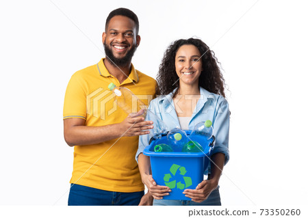 Family Couple Holding Box With Recycle Symbol Over White Background 73350260