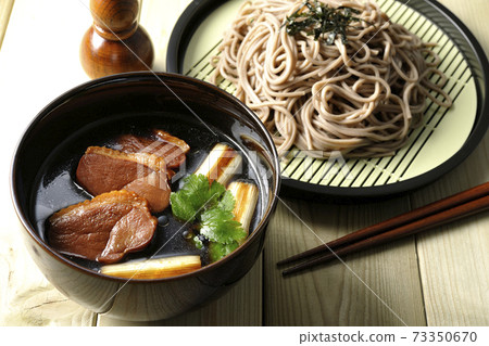 Roast duck meat, roasted duck green onions, duck seiro soba with trefoil, gourd-shaped shichimi bowl and chopsticks Roast duck meat, roasted duck green onions, duck seiro soba with trefoil, gourd-shaped shichimi bowl and chopsticks 73350670