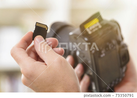 Hand with sd card Hand with sd card 73350791