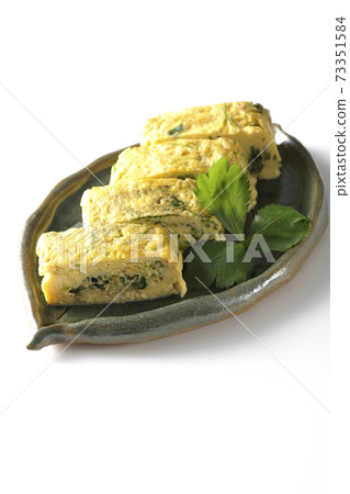 Photographed soup stock rolled egg with trefoil on a white background 73351584