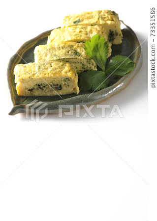 Photographed soup stock rolled egg with trefoil on a white background 73351586
