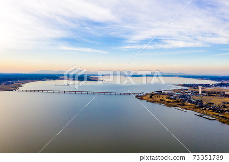 Kasumigaura Bridge over Kasumigaura at dusk in winter and Mt. Tsukuba in the distance 73351789
