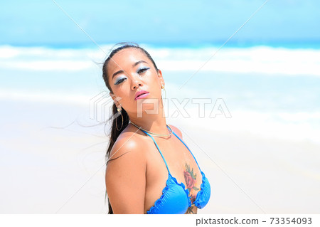 Tan on a beautiful beach 73354093