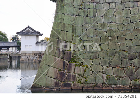 Stone wall of Nijo Castle in Kyoto 73354291