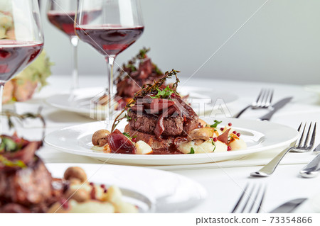 Gourmet appetizer: Beautifully decorated catering banquet foie gras with berries 73354866