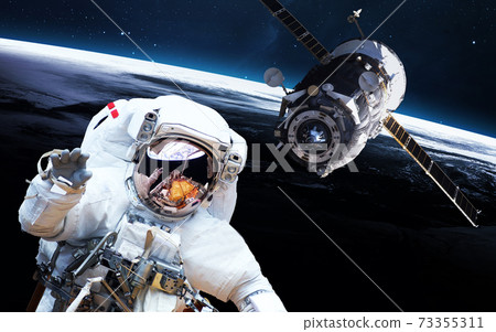 Astronaut and satellite Astronaut and satellite 73355311